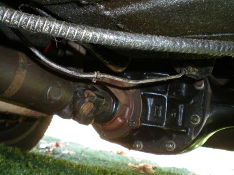 1966 Ford Mustang - Underside view of a vehicle's driveshaft and differential assembly, showing mechanical components.