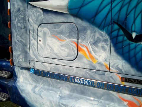 1978 Ford Bronco - Custom airbrushed artwork adorns the side of a truck, wolves and ethereal figures with flames.