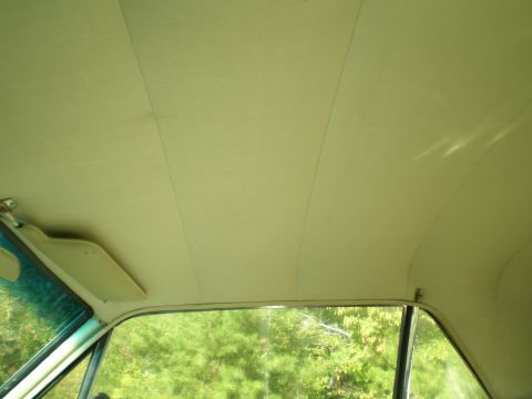 1966 Ford Mustang - Interior view of a 1966 Ford Mustang, showing the headliner and sun visor.