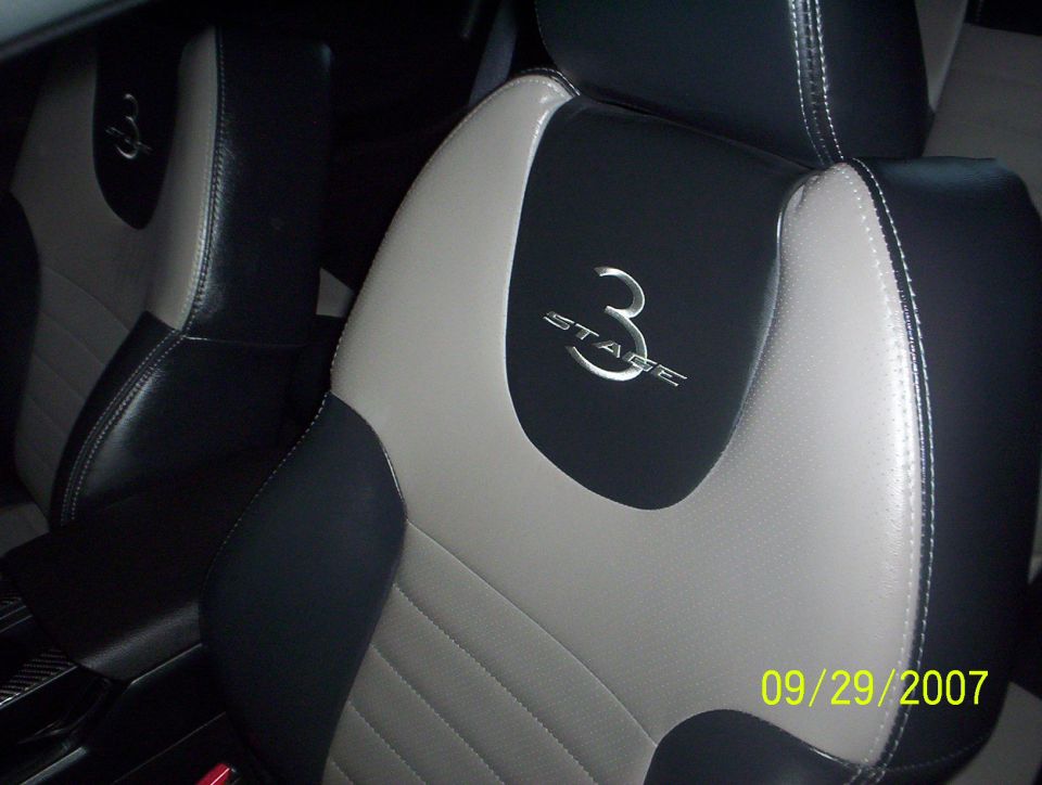 Black and gray leather Roush Stage 3 seats with embroidered logos inside a Mustang