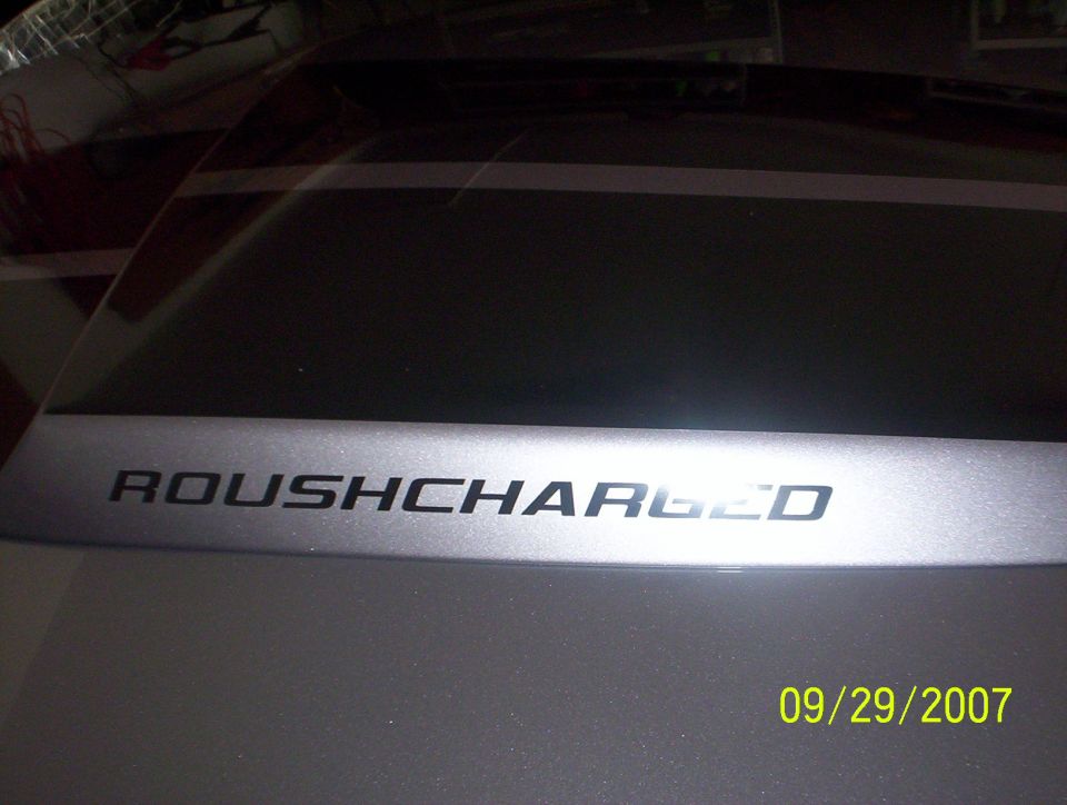 Black ROUSHCHARGED decal on silver Mustang hood scoop, dated 09/29/2007