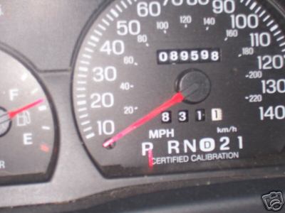 2001 Ford Crown Victoria - Close-up of a car's dashboard gauges, including the speedometer and odometer.