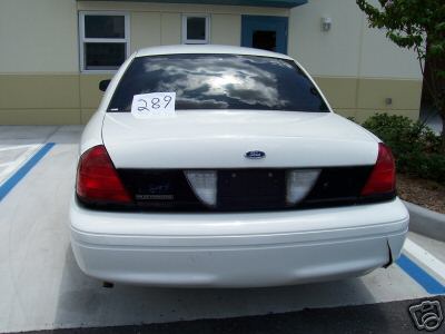2001 Ford Crown Victoria - This 2001 Ford Crown Victoria is seen from the rear, with a paper note taped to the back window.