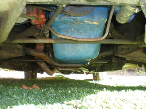1966 Ford Mustang - Underside view of a 1966 Ford Mustang, showing the engine and oil pan.