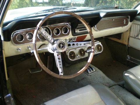 1966 Ford Mustang - The interior of a 1966 Ford Mustang shows its classic dashboard and steering wheel.