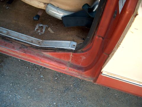 1979 Ford F-250 - Close-up of the interior door sill and floor area of an older vehicle.