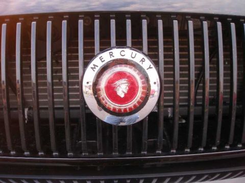 2001 Ford Crown Victoria - The emblem on the grille clearly shows the Mercury logo, not a Ford.