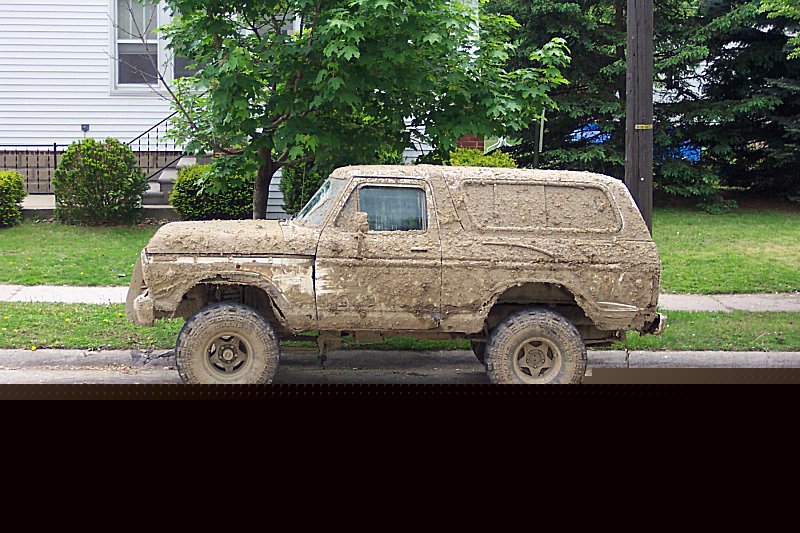 Mud-covered 1978 Ford Bronco side view