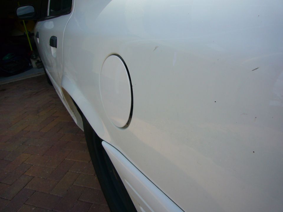 White 2001 Ford Crown Victoria side view showing fuel door
