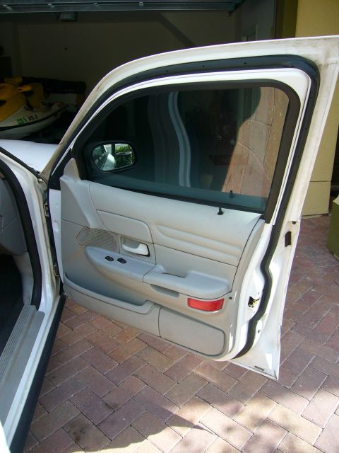2001 Ford Crown Victoria - Interior view of the driver's side door panel on a 2001 Ford Crown Victoria.