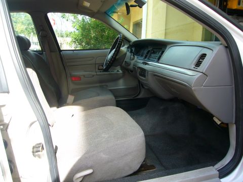 2001 Ford Crown Victoria - The interior of a 2001 Ford Crown Victoria is visible from the driver's side door.
