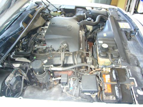 2001 Ford Crown Victoria - Engine bay of a 2001 Ford Crown Victoria, showing the V8 engine and associated components.