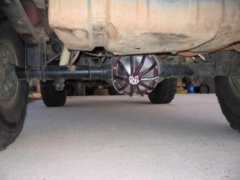 1995 Ford Bronco - Custom purple differential cover on the rear axle of a vehicle.