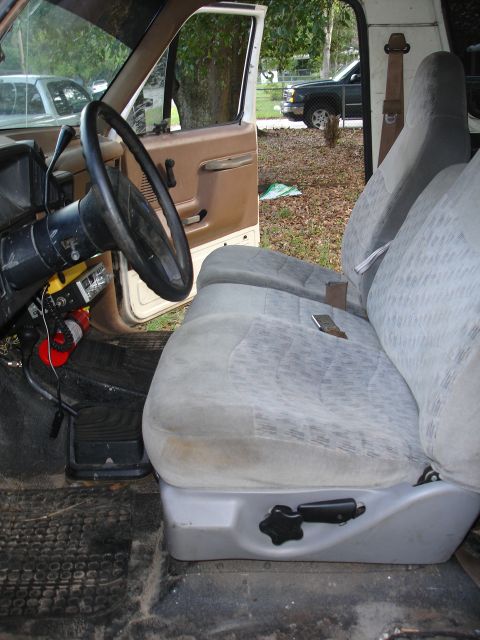 1989 Ford Bronco - Interior view of a truck, possibly a 1990 model, with a focus on the driver's seat and controls.