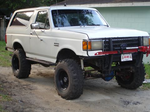 1989 Ford Bronco - This 1989 Ford Bronco features significant off-road modifications, including a lift kit and large tires.