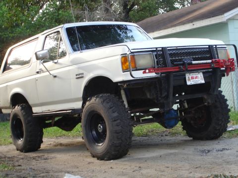 1989 Ford Bronco - This lifted 1989 Ford Bronco features a custom front bumper and large off-road tires.