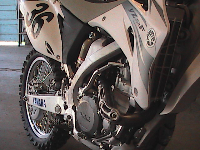 White Yamaha YZ450F dirt bike, side view, with number 36