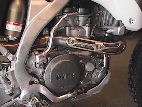 2007 Yamaha YZ450F - Yamaha engine detail, focusing on the crankcase and exhaust system components.
