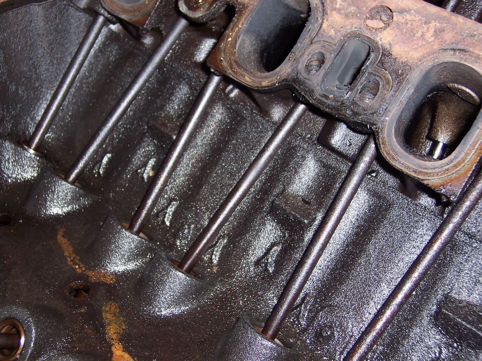 close-up of engine block with pushrods and part of cylinder head