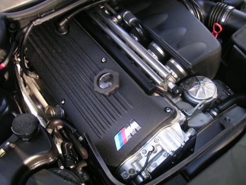 2002 BMW M3 - Close-up of a BMW M engine bay, the M logo on the engine cover.