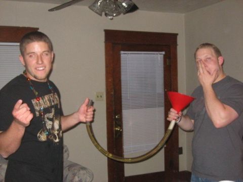 1996 Ford Bronco - Two men are holding a beer funnel and tube, possibly for a drinking game.