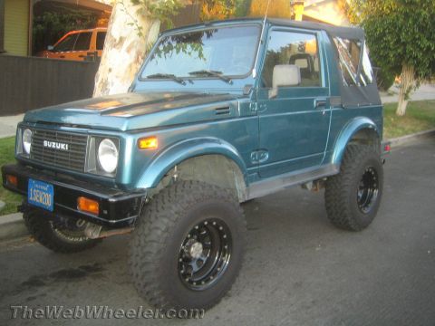 1987 Suzuki Samurai - This 1987 Suzuki Samurai is equipped with off-road tires and a soft top.