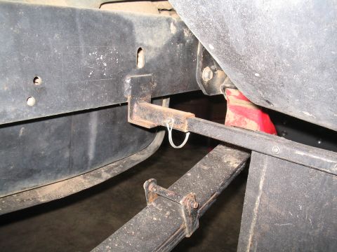 1989 Ford Bronco - Detail shot of a vehicle's undercarriage, focusing on the frame and suspension components.