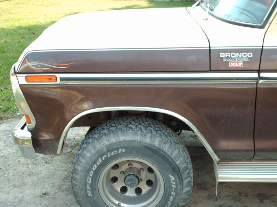1979 Ford Bronco front fender, wheel, and side trim. Bronco Ranger XLT badge visible