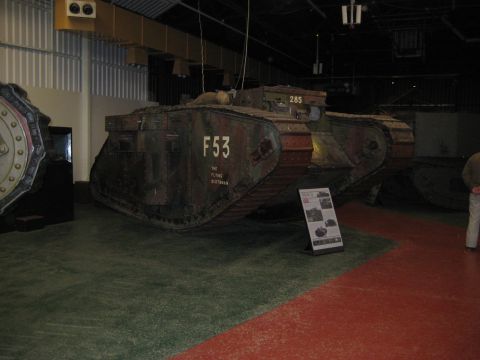 1966 Jeep CJ5 - Museum display features a tank marked F53, with other vehicles visible in the background.
