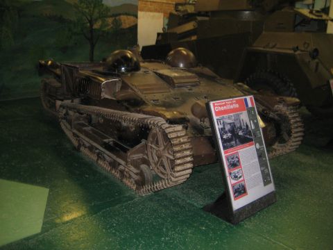 1966 Jeep CJ5 - A Renault UE Chenillette tank is displayed in a museum setting with an informational placard detailing its history.