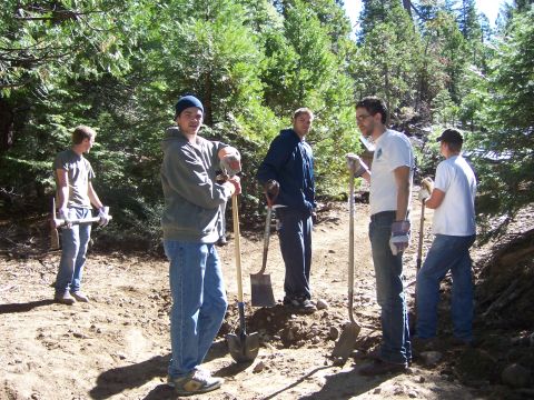 1991 Ford Bronco - A group of men pause their work on a sunny day, surrounded by trees and dirt.