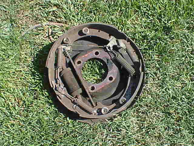the stock brake assembly, i used the center of this as a spacer for the new setup.