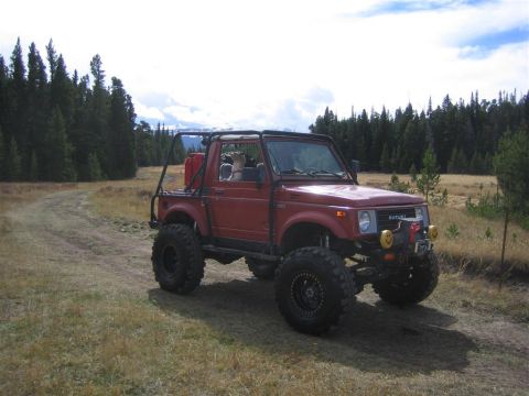 1987 Suzuki Samurai - This modified 1987 Suzuki Samurai is ready for off-road adventure, oversized tires and a protective roll cage.