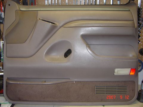 1993 Ford Bronco - Here they can be seen on the top of the door panel. They are removed from the back by bending some metal tabs.