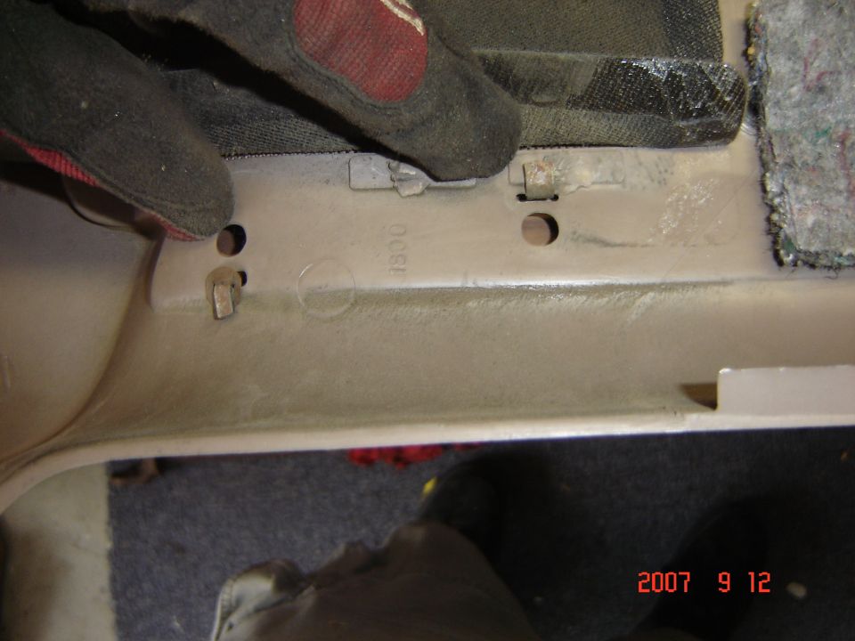Here's the metal tabs you have to bend up to get the door trim off.