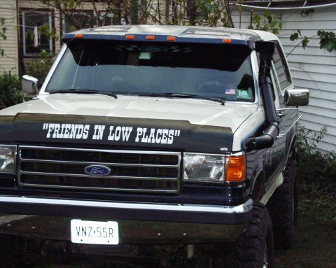 1989 Ford Bronco - This 1989 Ford Bronco is equipped with a custom snorkel and a humorous decal on its hood.