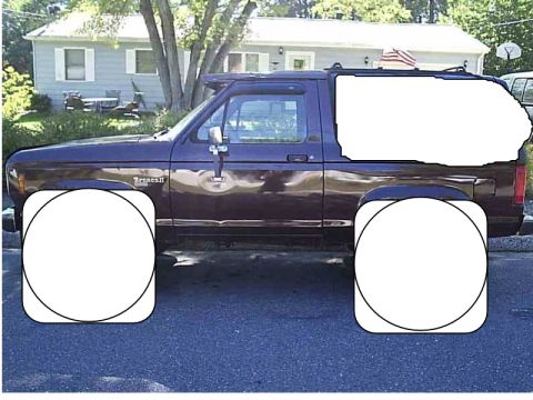 1995 Dodge 1500 - Side profile of a maroon Ford Bronco II, likely from the late 1980s.