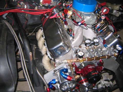1995 Ford Bronco - Close-up of a modified engine custom fuel delivery and monitoring systems.