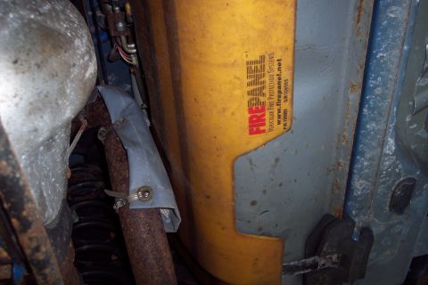 2001 Ford Crown Victoria - FIREPANEL vehicular fire protection system installed on vehicle underbody.
