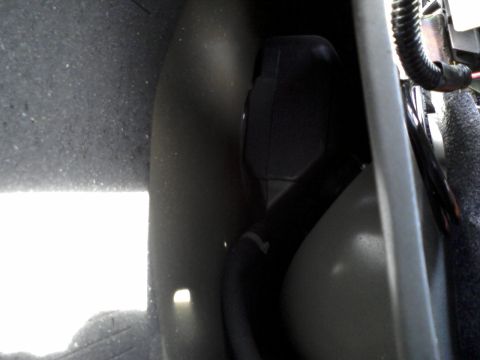 1996 Mercury Grand Marquis - The stock NON-remote release fuel filler door opening - as viewed from in the trunk, behind the carpeting - between the fender and trunk br…
