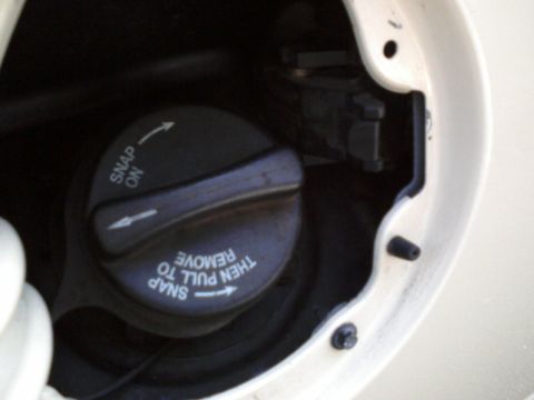 1996 Mercury Grand Marquis - After some work with the dremel from the BACK SIDE, I made a square opening for the fuel door release solenoid to slide through. I used som…