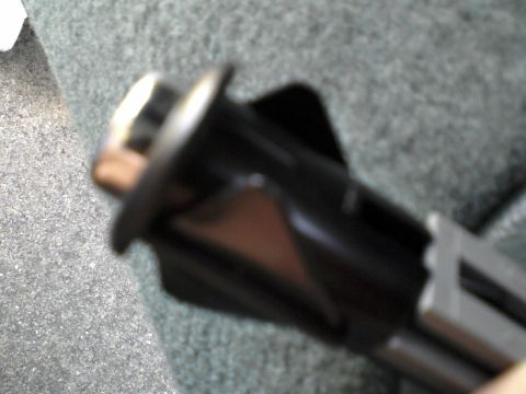 1996 Mercury Grand Marquis - A close up of the mounting tabs used on both the fuel and trunk door release switches. It is a very thin plastic.