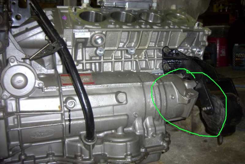 Ford engine block and transaxle with rear bracket circled in green marker