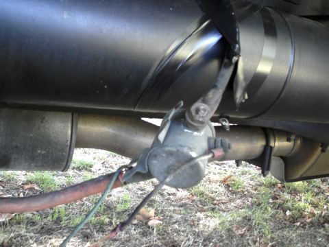 1996 Mercury Grand Marquis - Detail of an exhaust system component, possibly related to emissions control, with visible wiring.