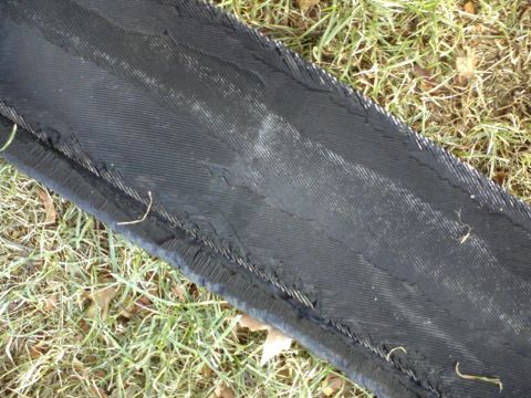 1996 Mercury Grand Marquis - Close-up of a damaged tire tread, showing separation and wear.