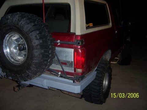 1995 Ford Bronco - This SUV has a spare tire mounted on the rear and a custom bumper.