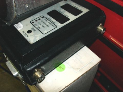 1993 Ford Mustang - Close-up of an electronic device's control panel with various status indicators and buttons.