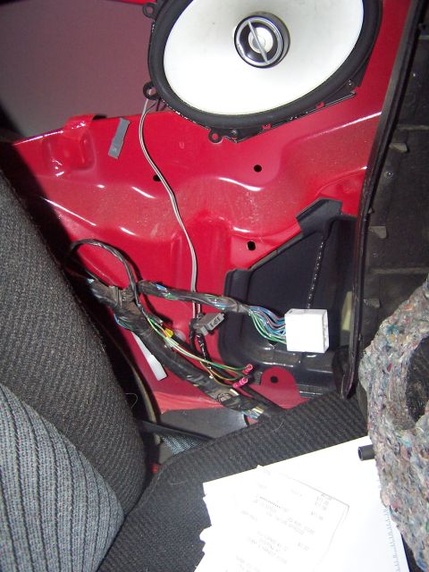 1994 Ford Probe - Interior view of a car door panel showing speaker wiring and insulation.