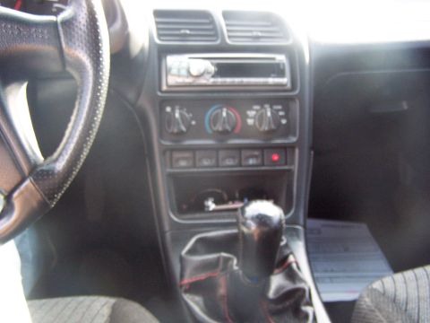 1994 Ford Probe - Interior view of a 1994 Ford Probe, highlighting the dashboard and center console features.