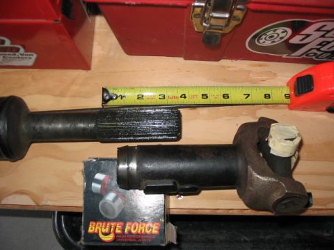 1995 Ford Bronco - Driveshaft components are measured with a tape measure, with a "Brute Force" box in the foreground.